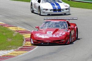Amy Ruman's Chevy Corvette chased by Cliff Ebben's Ford Mustang