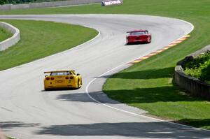 David Fershtand's Olds Cutlass Supreme ahead of Daniel Parr's Chevy Corvette through corner 13.