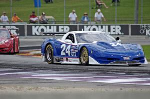 Rick Dittman's Chevy Corvette holds off Amy Ruman's Chevy Corvette