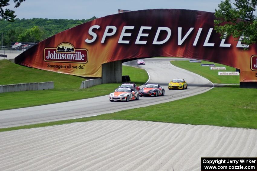 MX-5s entering the carousel