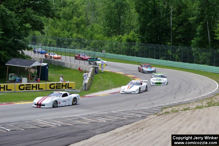 Front end of the field comes through Canada Corner on the pace lap.