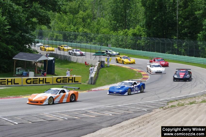 Mid-section of the field comes through Canada Corner on the pace lap.