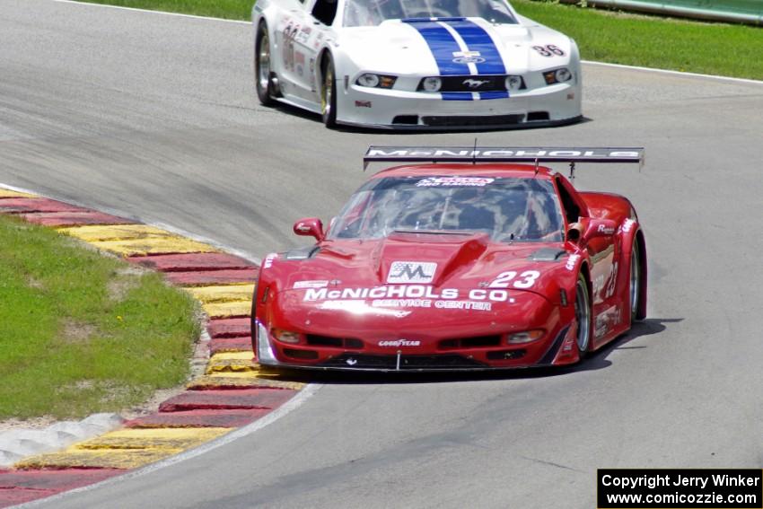 Amy Ruman's Chevy Corvette chased by Cliff Ebben's Ford Mustang