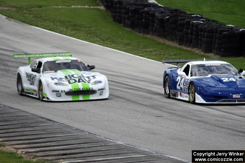 Rick Dittman's Chevy Corvette races past the stalled Jaguar XKR of Tomy Drissi