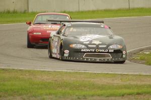 George Prentice, Jr.'s SPO Chevy Monte Carlo and Greg Youngdahl's Spec Miata Mazda Miata