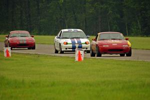 Greg Youngdahl's Spec Miata Mazda Miata, John Glowaski's ITA Dodge Neon ACR and Lon Blaser's Spec Miata Mazda Miata