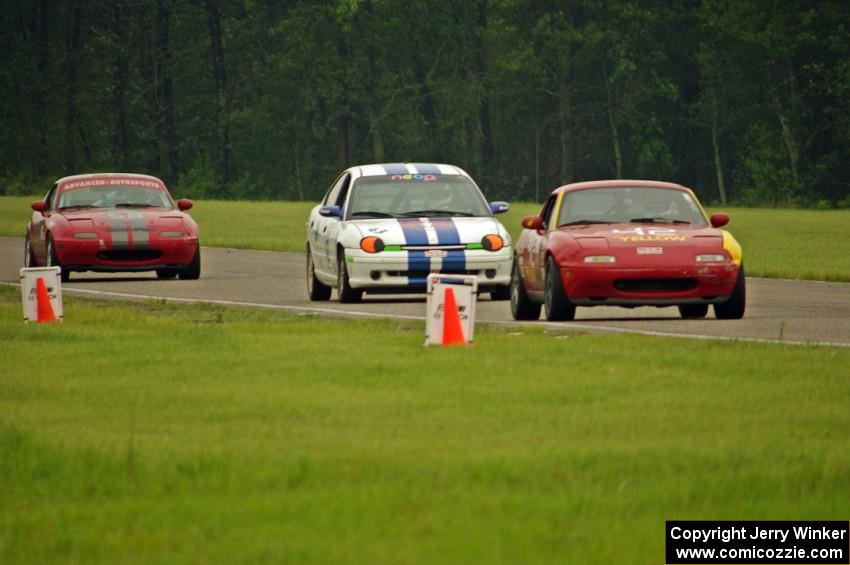 Greg Youngdahl's Spec Miata Mazda Miata, John Glowaski's ITA Dodge Neon ACR and Lon Blaser's Spec Miata Mazda Miata