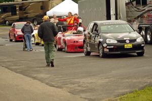 Showroom Stock and small Production cars line up for post-race weigh-in