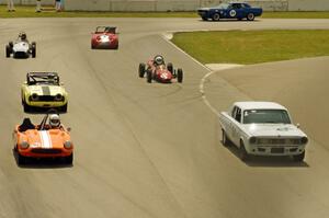 The vintage field lines up before the bridge