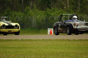 Phil Schaefer's Austin-Healey Sprite and John Hagen's Triumph TR-4