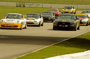 GT, Touring and Spec Miata field come below the bridge on the pace lap