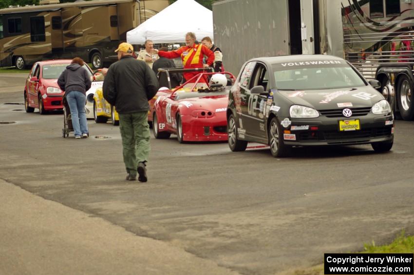 Showroom Stock and small Production cars line up for post-race weigh-in