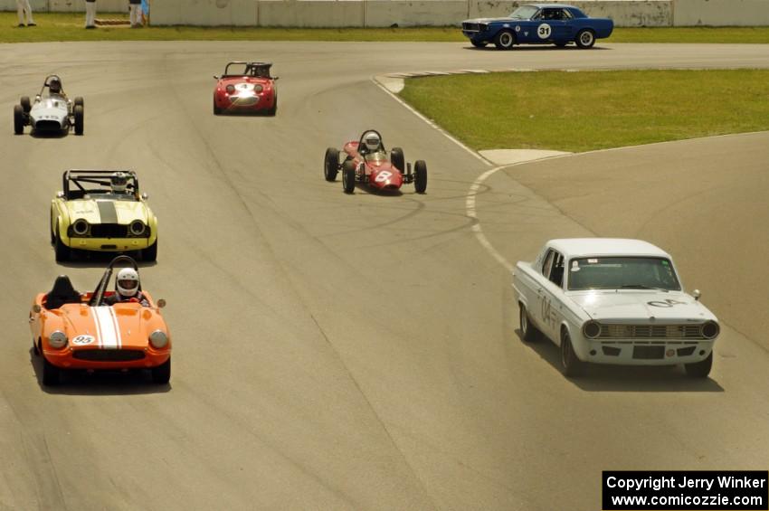 The vintage field lines up before the bridge