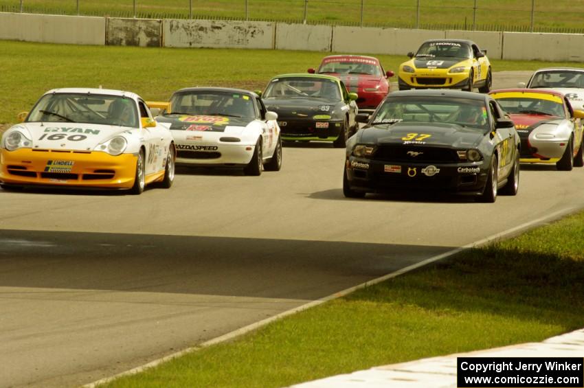 GT, Touring and Spec Miata field come below the bridge on the pace lap