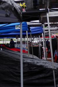 Cars in the paddock waiting out the rain on Saturday morning