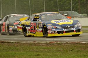 Eric Holmes' Toyota Camry and Michael Self's Chevy Impala