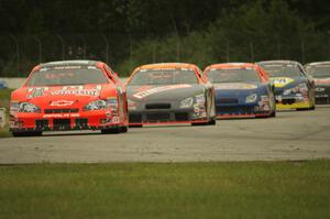 Cars stream into turn 12 during the race