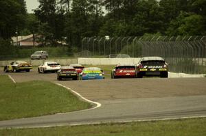 The field heads out of turn 6 into 7/8 under caution