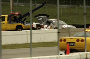 Anthony Giannone's Chevy Impala comes in on the hook after losing its brakes and impacting the wall at turn 12