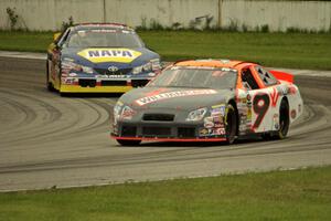 Austin Dyne's Ford Taurus and Eric Holmes' Toyota Camry