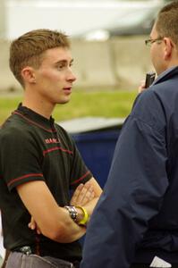 Michael Self is interviewed after winning in his Chevy Impala