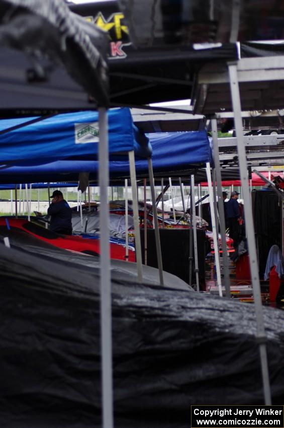 Cars in the paddock waiting out the rain on Saturday morning