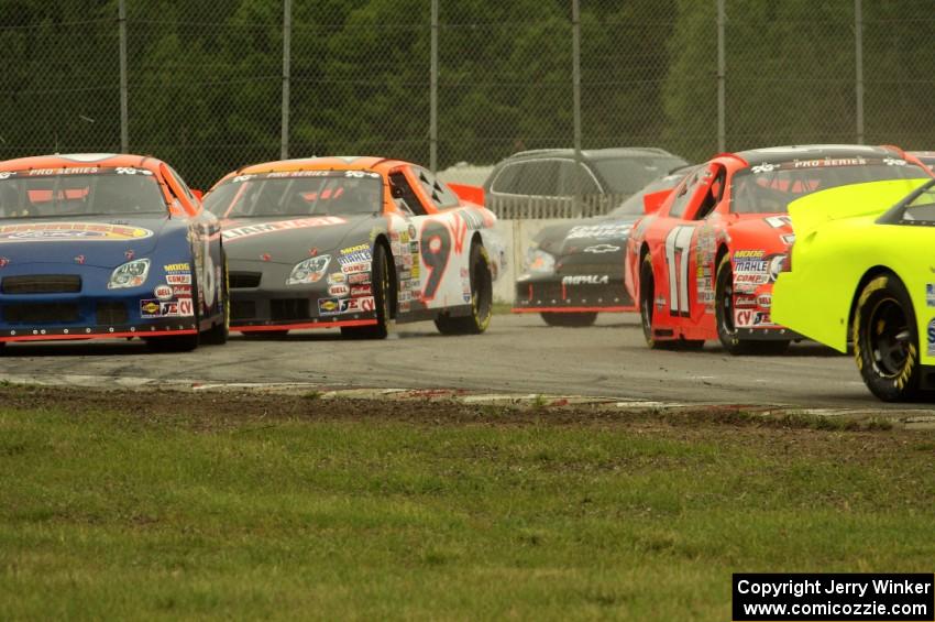 Cars at the first turn after the green