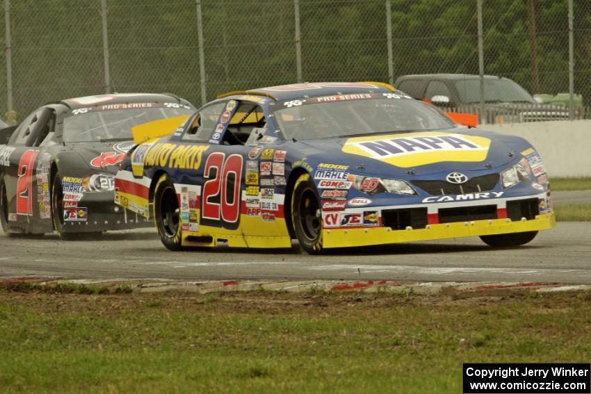 Eric Holmes' Toyota Camry and Michael Self's Chevy Impala