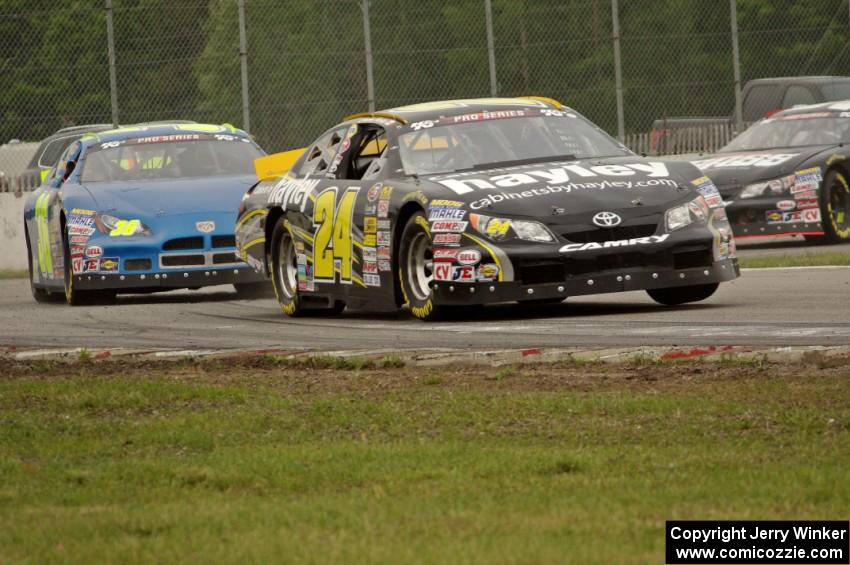 Cameron Hayley's Toyota Camry and John Wood's Dodge Charger