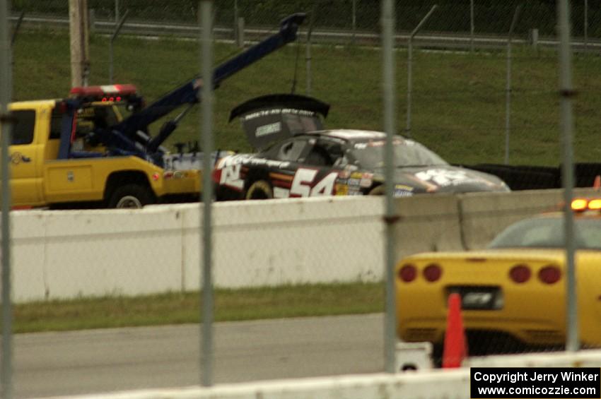 Anthony Giannone's Chevy Impala comes in on the hook after losing its brakes and impacting the wall at turn 12