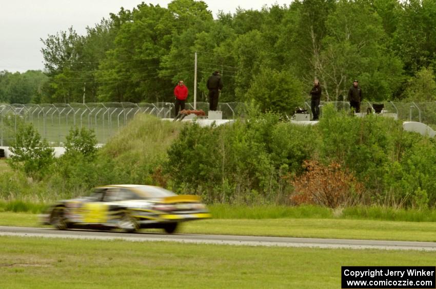 Spotters on the track's 20,000 gallon waste container inside the carousel