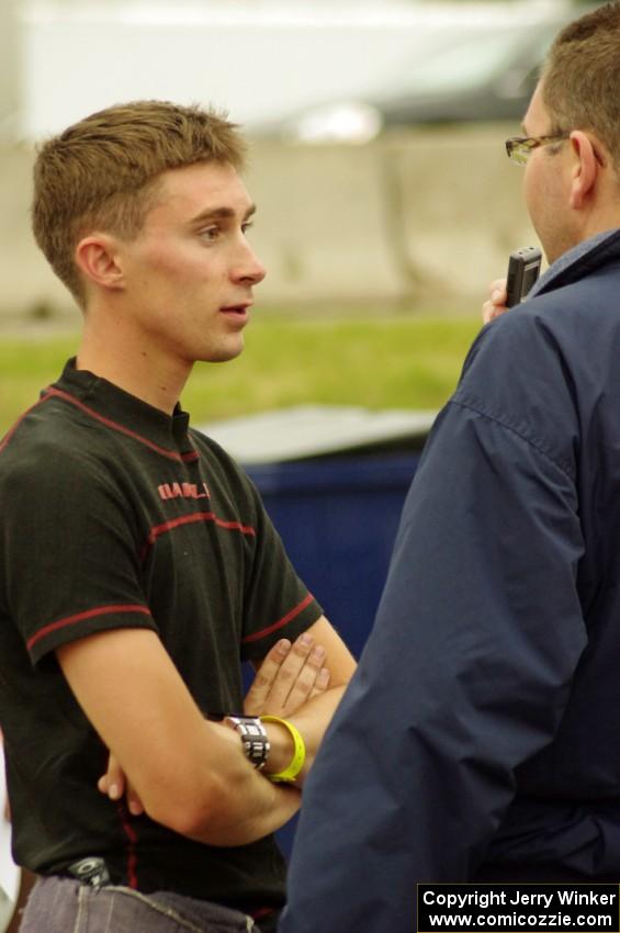 Michael Self is interviewed after winning in his Chevy Impala