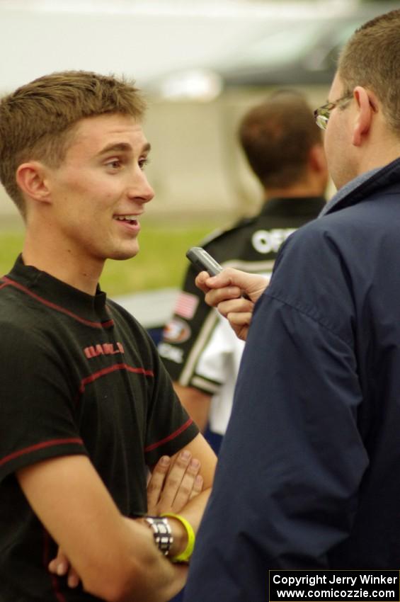 Michael Self is interviewed after winning in his Chevy Impala