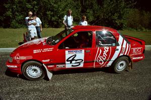 Mike Whitman / Paula Gibeault Ford Sierra Cosworth  prepares to leave parc expose for day two's stages.