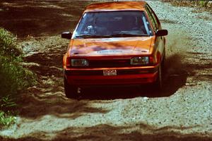 Gail Truess / Pattie Hughes Mazda 323GTX near the start of SS8 (Thorpe Tower).