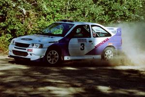 Carl Merrill / Lance Smith Ford Escort Cosworth RS at the spectator point on SS10 (Kabekona).