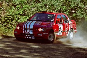 Mike Whitman / Paula Gibeault Ford Sierra Cosworth at the spectator point on SS10 (Kabekona).