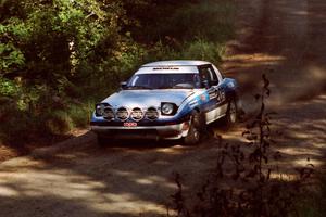 Mike Hurst / Rob Bohn Mazda RX-7 at the spectator point on SS10 (Kabekona).