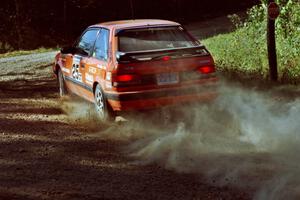 Gail Truess / Pattie Hughes Mazda 323GTX at the spectator point on SS10 (Kabekona).