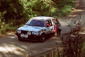 Dave White / Cindy Krolikowski VW GTI at the spectator point on SS10 (Kabekona).