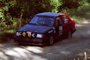 Rod Dean / Nichole Hunter Ford Escort GT at the spectator point on SS10 (Kabekona).