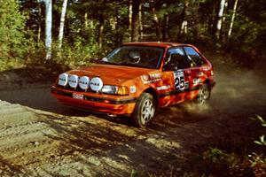 Gail Truess / Pattie Hughes Mazda 323GTX at speed on SS12 (Parkway).