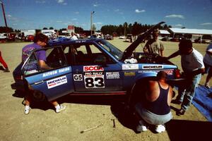 Crew members swarm around the Mark Utecht / Doug Dill Dodge Omni GLH-Turbo at Park Rapids service.