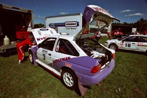 The Carl Merrill / Lance Smith Ford Escort Cosworth RS and David Summerbell / Mike Fennell Mitubishi Lancer Evo IV at service.