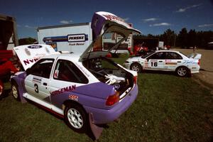 The Carl Merrill / Lance Smith Ford Escort Cosworth RS and David Summerbell / Mike Fennell Mitubishi Lancer Evo IV at service.