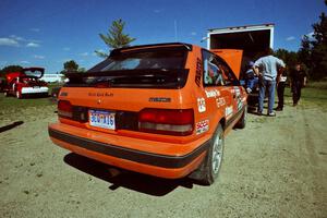 Gail Truess / Pattie Hughes Mazda 323GTX gets serviced at the West Forty in Park Rapids on day two.