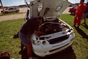 Carl Merrill works on the Ford Escort Cosworth RS he and Lance Smith shared for the event.