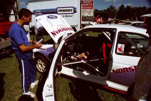 Eric Carlson watches as son Jake sits in the driver's seat of the Carl Merrill / Lance Smith Ford Escort Cosworth RS.