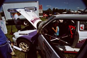 Eric Carlson watches as son Jake sits in the driver's seat of the Carl Merrill / Lance Smith Ford Escort Cosworth RS.