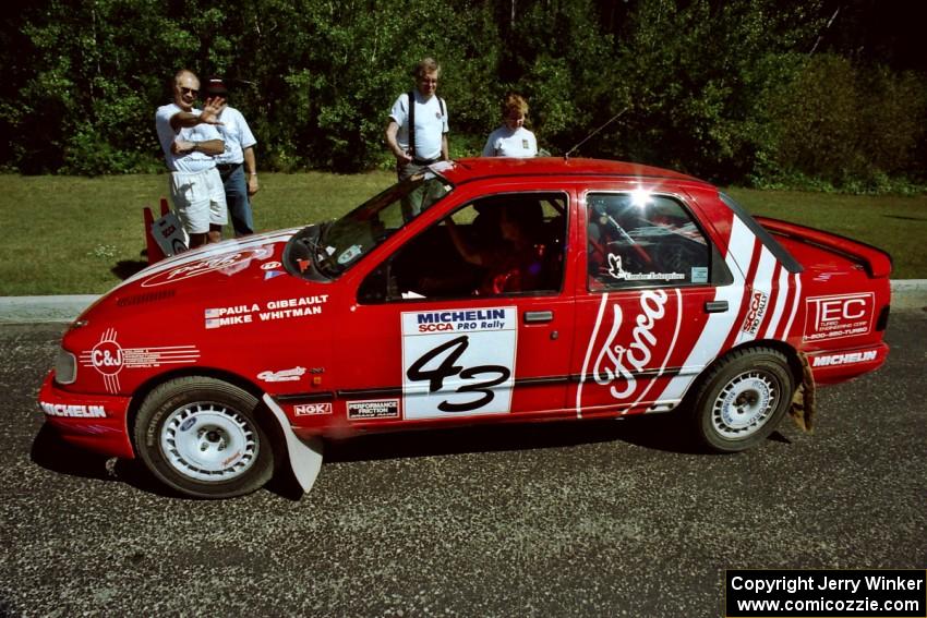 Mike Whitman / Paula Gibeault Ford Sierra Cosworth  prepares to leave parc expose for day two's stages.